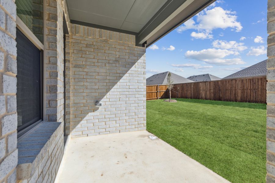 Covered Patio in the Heisman home plan by Trophy Signature Homes – REPRESENTATIVE PHOTO