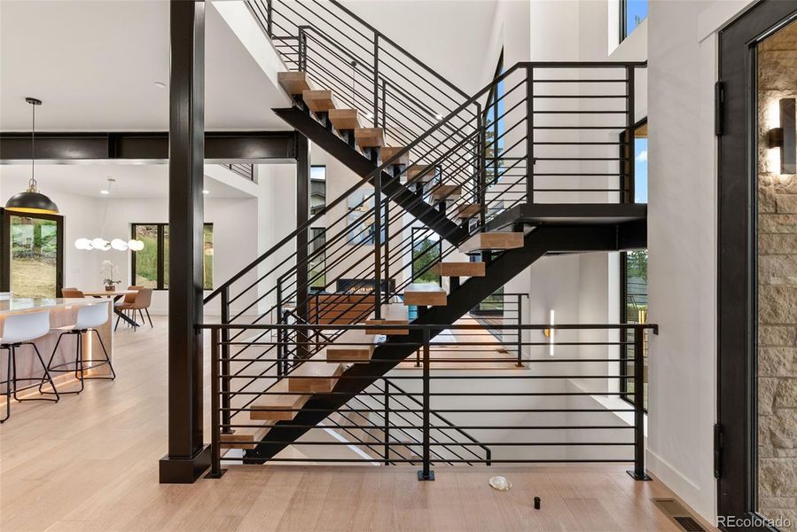 The floating staircase is the perfect centerpiece