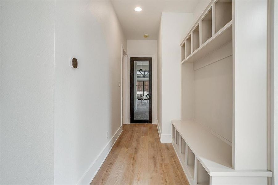 Mudroom with recessed lighting, light wood-type flooring, and baseboards