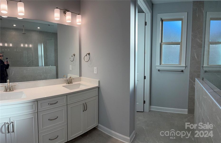 Owner Suite Bath features Double Vanity and separate Water Closet