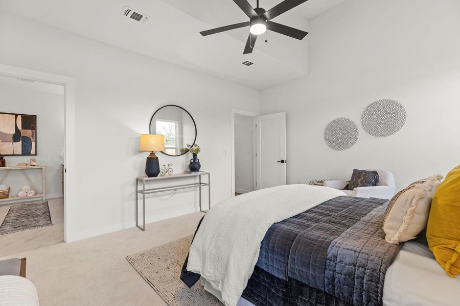Bedroom featuring carpet floors and ceiling fan
