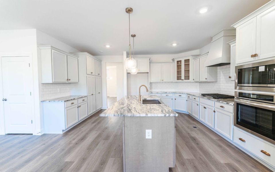 Furnished interior view inside a new home in Aden Woods, Fairview (Image 7).