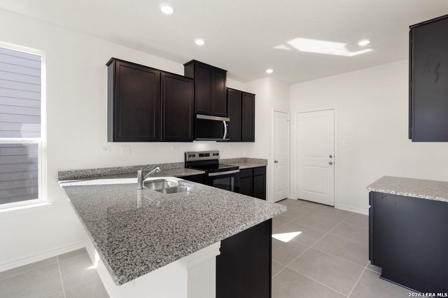 Furnished interior view inside a new home in Spanish Trails Villas, San Antonio (Image 12).