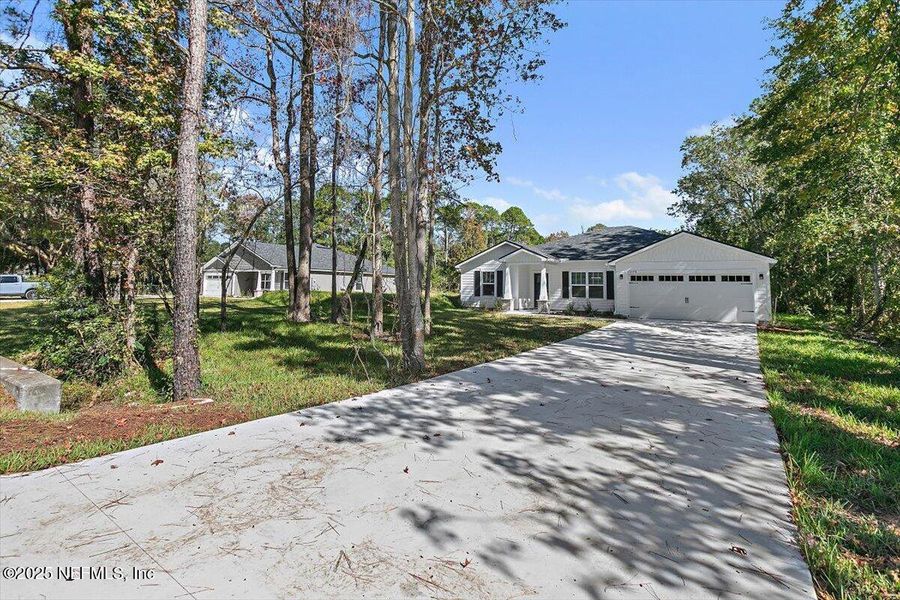 Front exterior of a new home in , Jacksonville, FL, highlighting curb appeal (Image 22).