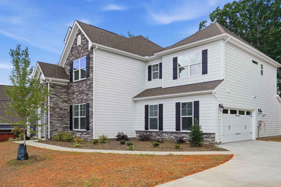 Front exterior of a new home in Robinson Oaks, Gastonia, NC, highlighting curb appeal (Image 2).