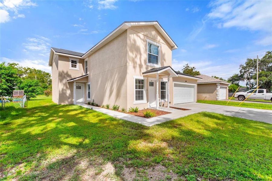 Front exterior of a new home in , Bartow, FL, highlighting curb appeal (Image 2).