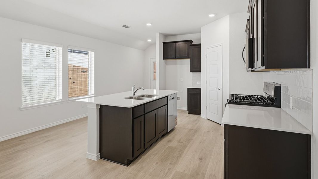 Representative furnished interior of a home built from the Douglas by D.R. Horton in Silverado, Aubrey (Image 3).