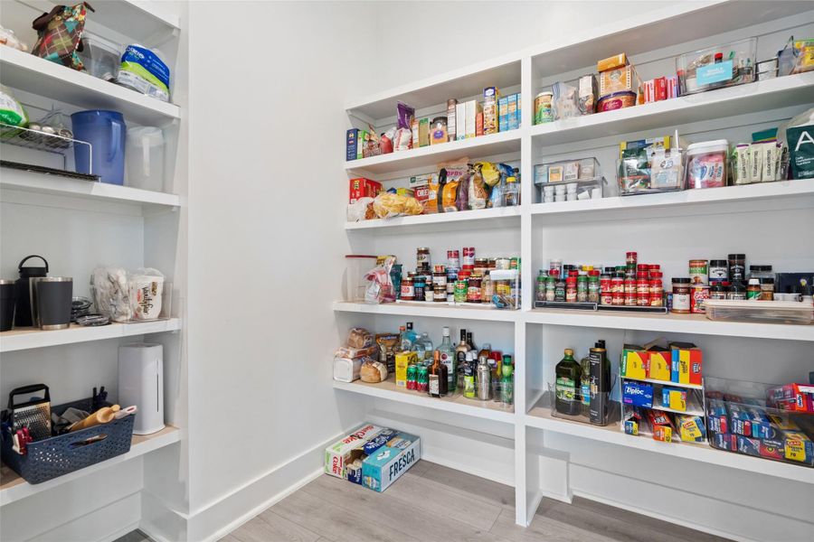 The main level is thoughtfully curated for both grand entertaining and everyday living, featuring a private study, an expansive great room, formal dining area, and a chef-inspired kitchen outfitted with premium luxury appliances, a walk-in pantry, and an oversized center island ideal for gathering.