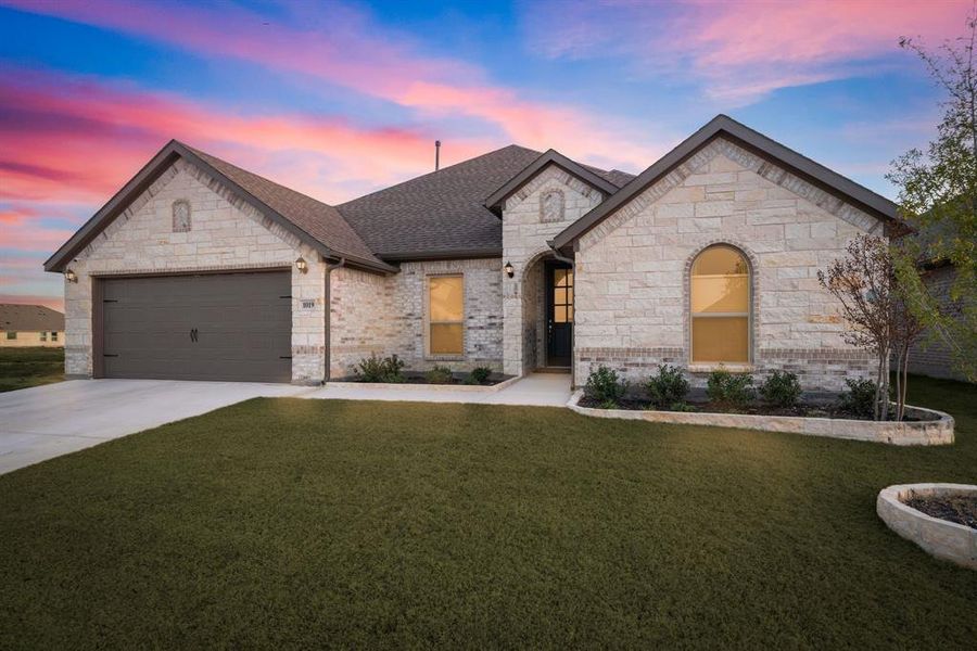 Front exterior of a new home in Timberbrook, Justin, TX, highlighting curb appeal (Image 21).