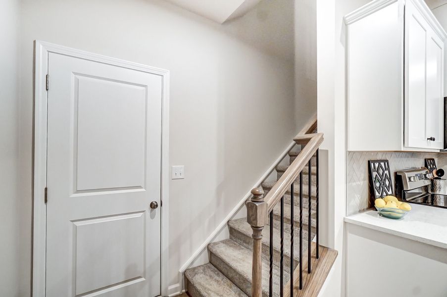 Stairway to second floor off kitchen