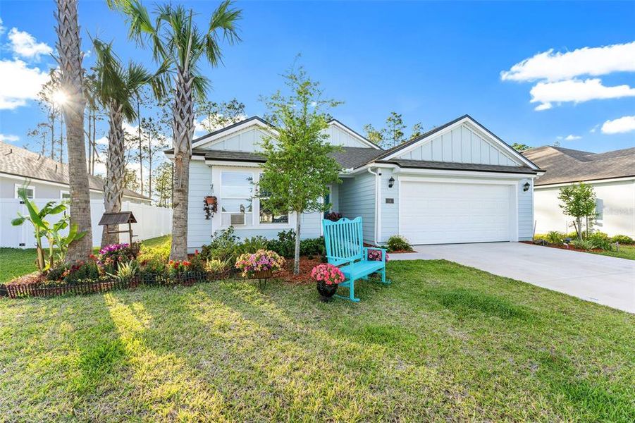 Front exterior of a new home in Sawmill Branch, Palm Coast, FL, highlighting curb appeal (Image 22).