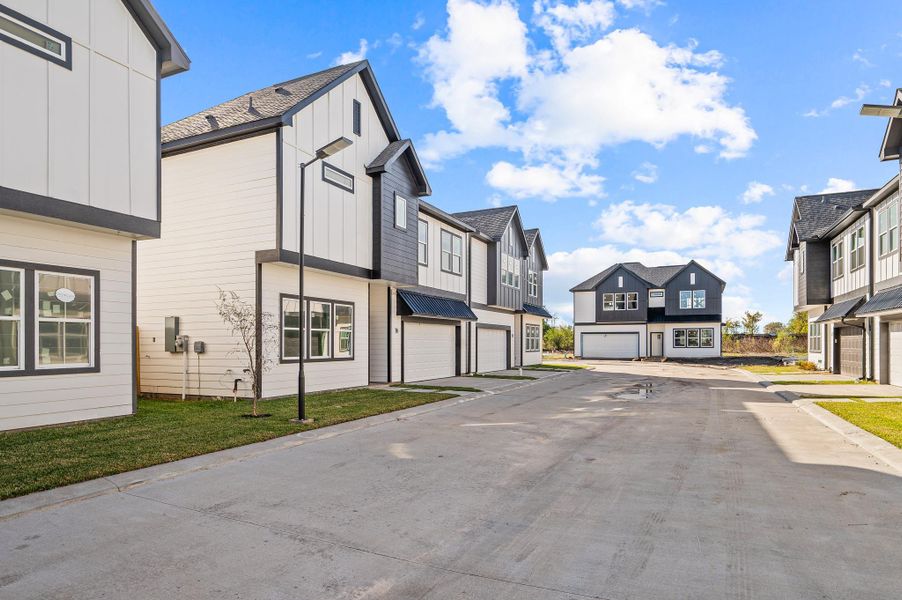 Front exterior of a new home in Metro Village, Houston, TX, highlighting curb appeal (Image 25). Front exterior of a new home in Metro Village, Houston, TX, highlighting curb appeal (Image 25).