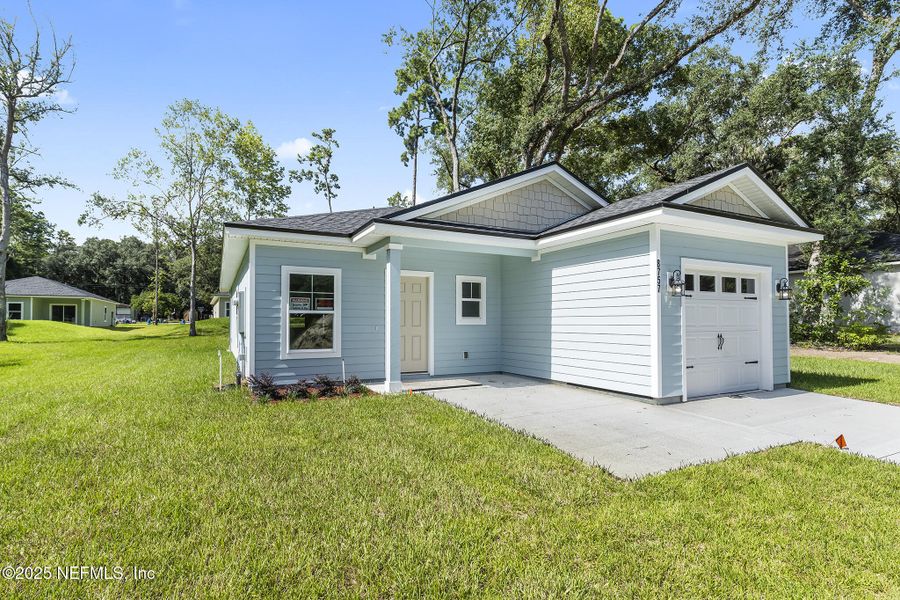 Front exterior of a new home in , Jacksonville, FL, highlighting curb appeal (Image 17).