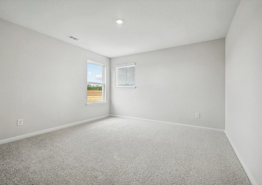 A spacious upstairs bedroom with two windows A spacious upstairs bedroom with two windows