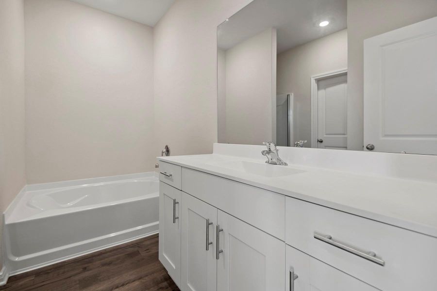 Furnished interior in a model home at Sweetwater Ridge in Conroe (Image 21).