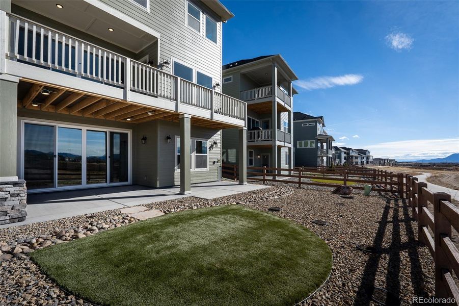 Exterior details and patio area of a home in Revel Crossing at Wolf Ranch - The Panorama Collection, Colorado Springs (Image 24).
