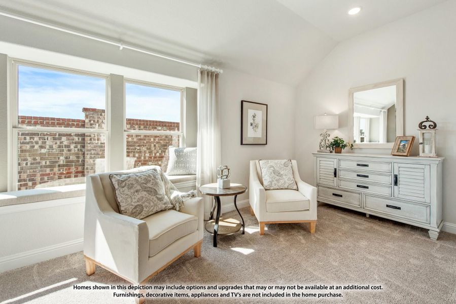 Sitting area with two white armchairs, dresser with mirror, vaulted ceiling, and large windows with natural light Sitting area with two white armchairs, dresser with mirror, vaulted ceiling, and large windows with natural light