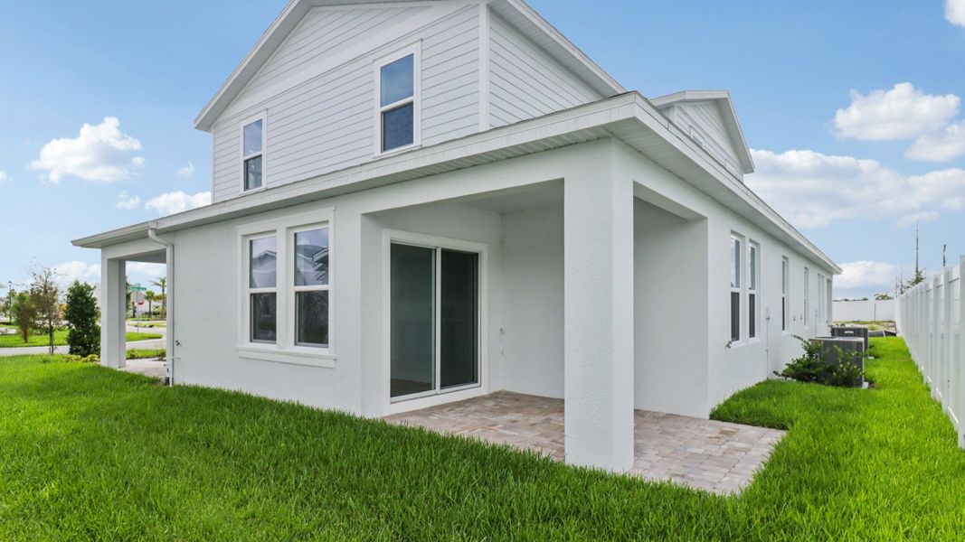 Exterior Back Monterey - End Townhome by DRB Homes at Cyrene at Harmony in St Cloud FL