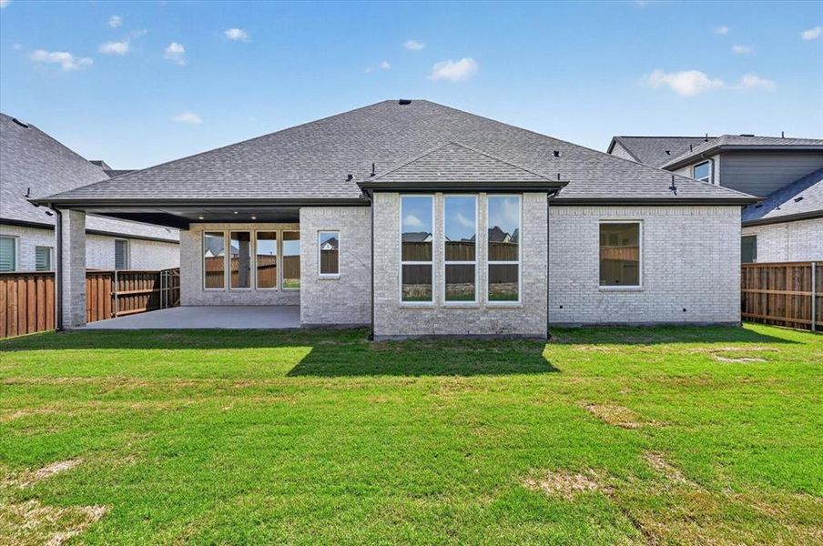 Exterior details and patio area of a home in Quail Hollow, Rockwall (Image 2).