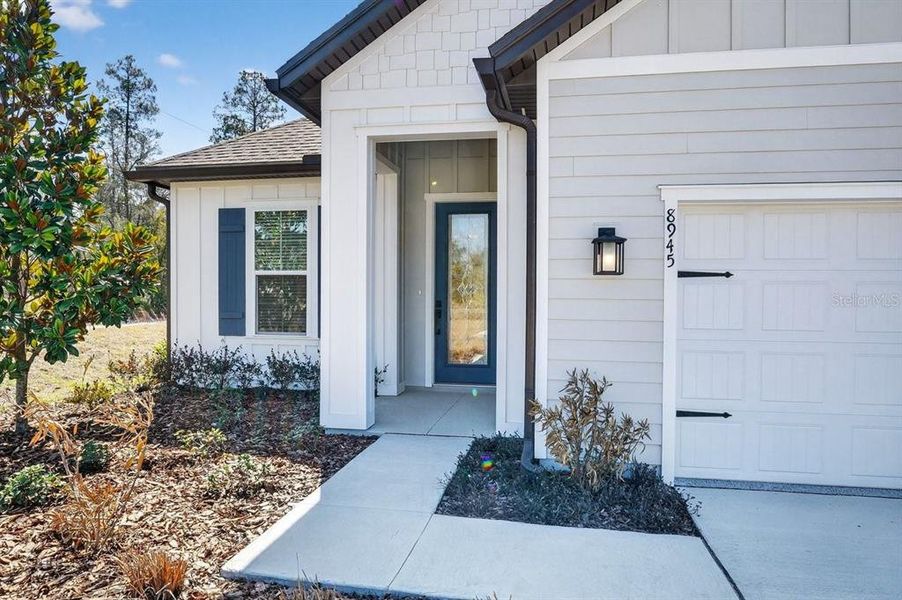 Exterior details and patio area of a home in Stables at Cary Forest, Bryceville (Image 3).