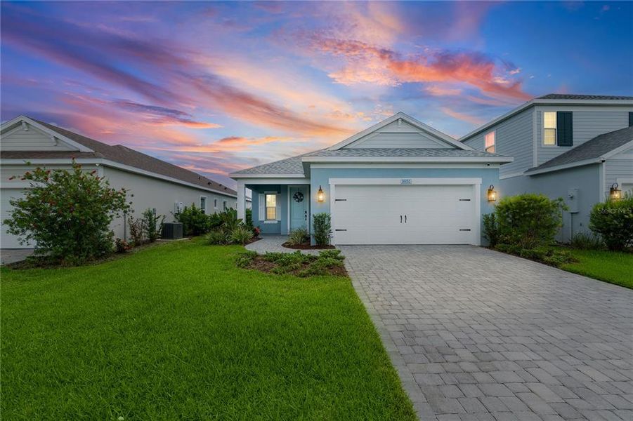 Front exterior of a new home in Wildleaf at North River Ranch, Parrish, FL, highlighting curb appeal (Image 21). Front exterior of a new home in Wildleaf at North River Ranch, Parrish, FL, highlighting curb appeal (Image 21).