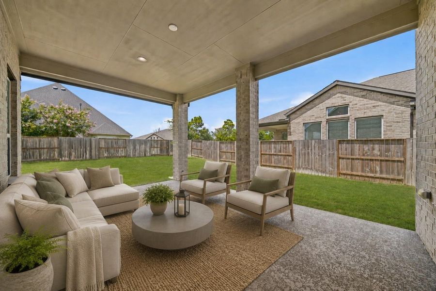 Step outside to enjoy the expansive backyard, complete with a covered patio — the perfect setup for outdoor dining, lounging, or weekend barbecues. *This photo has been virtually staged