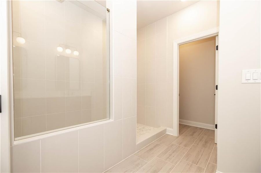 Mega shower option replaces the tub - this option is not in this lot- this homesite comes with a free-standing tub and walk in shower *Image is of previously built home* Mega shower option replaces the tub - this option is not in this lot- this homesite comes with a free-standing tub and walk in shower *Image is of previously built home*