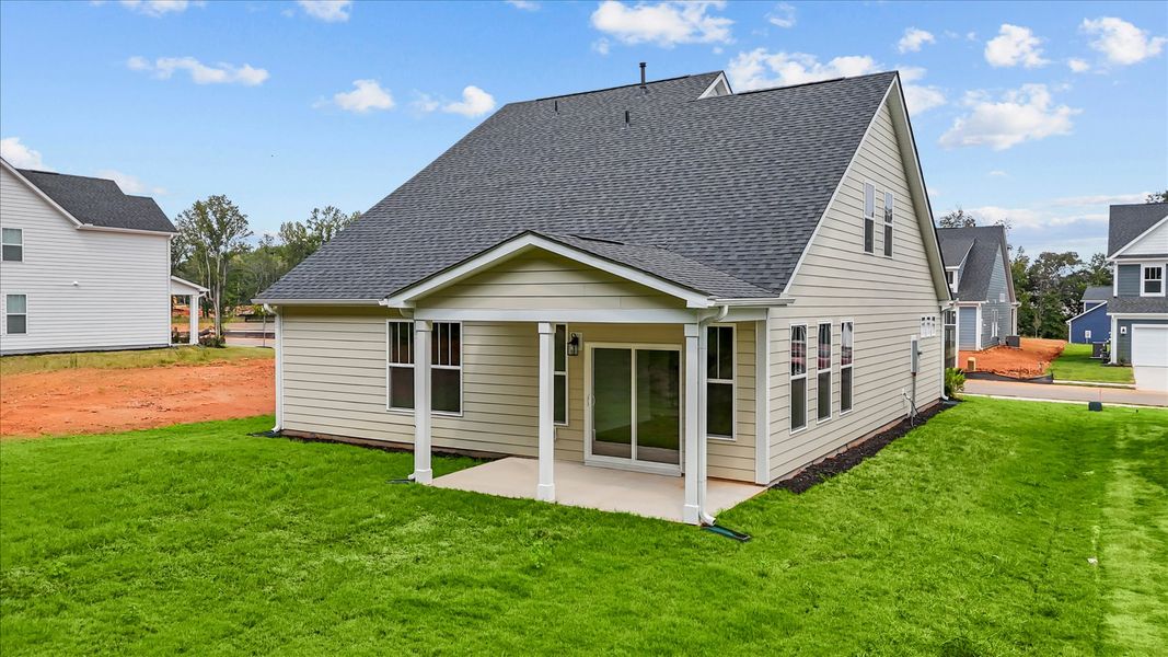Tasteful rear porch provides a peaceful retreat and effortless indoor-outdoor flow
