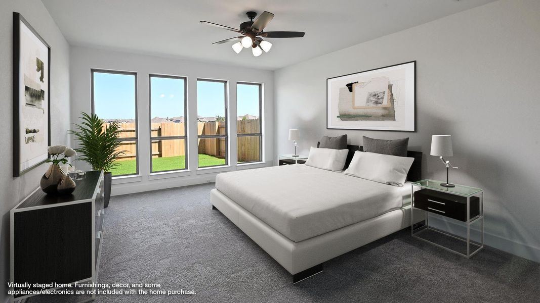 Carpeted bedroom with ceiling fan