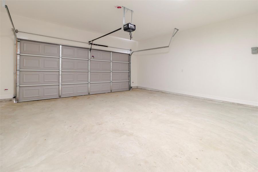 A true two-car garage with space for the vehicles, storage racks, or the things that never quite make it into the house. A true two-car garage with space for the vehicles, storage racks, or the things that never quite make it into the house.