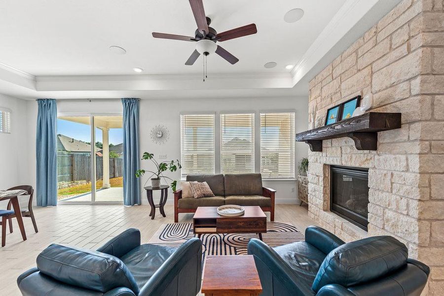 The living room overlooks the covered patio and backyard space.