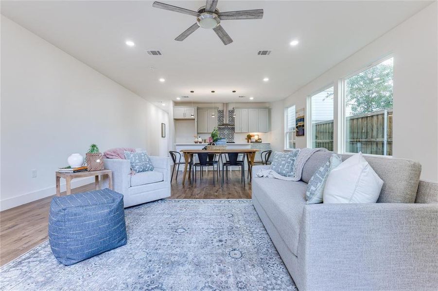 Living room featuring hardwood / wood-style floors and ceiling fan