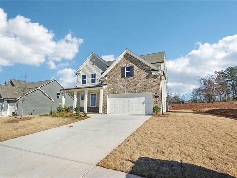 Front exterior of a new home in Wehunt Meadows, Hoschton, GA, highlighting curb appeal (Image 26).