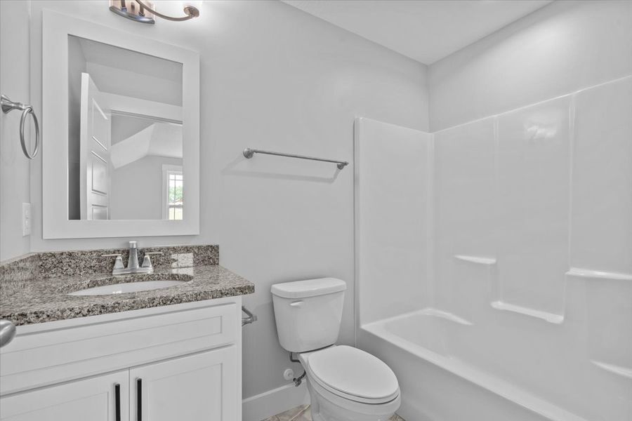 Representative furnished interior of a home built from the Hartford Elite by Enchanted Homes in Pointe Summit, Slater-Marietta (Image 19).