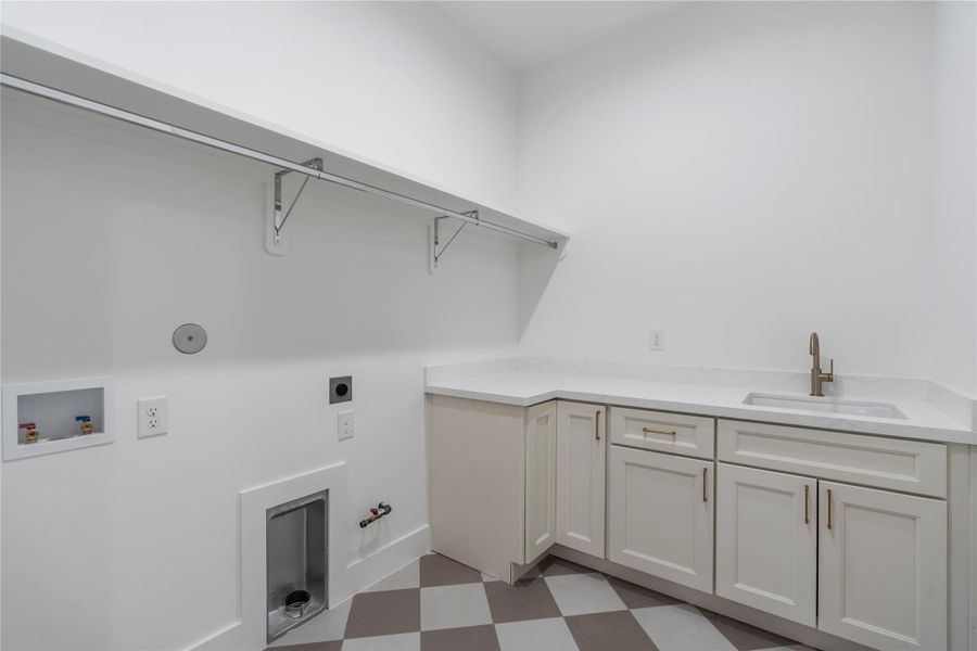 Spacious utility room with built-in storage.