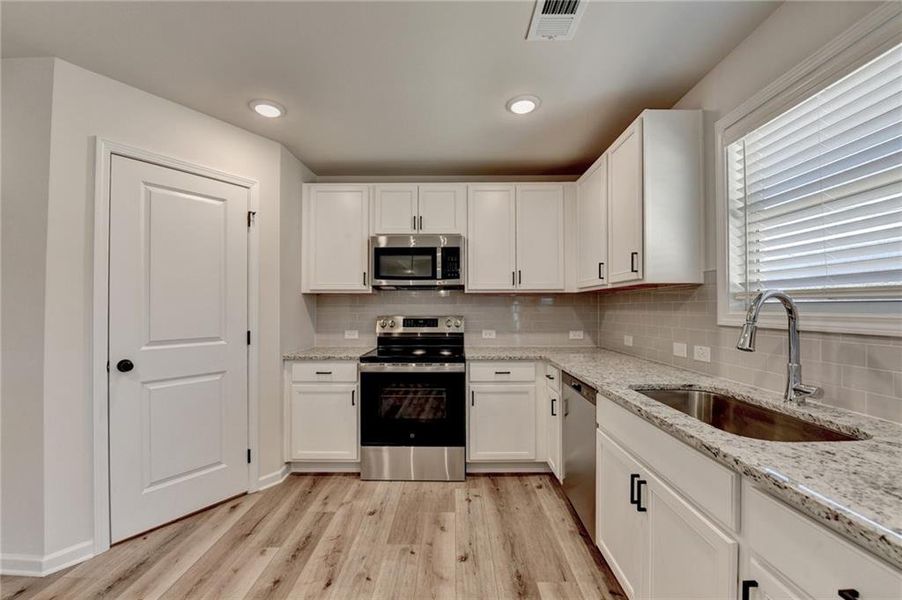 Furnished interior view inside a new home in , Auburn (Image 11). Furnished interior view inside a new home in , Auburn (Image 11).