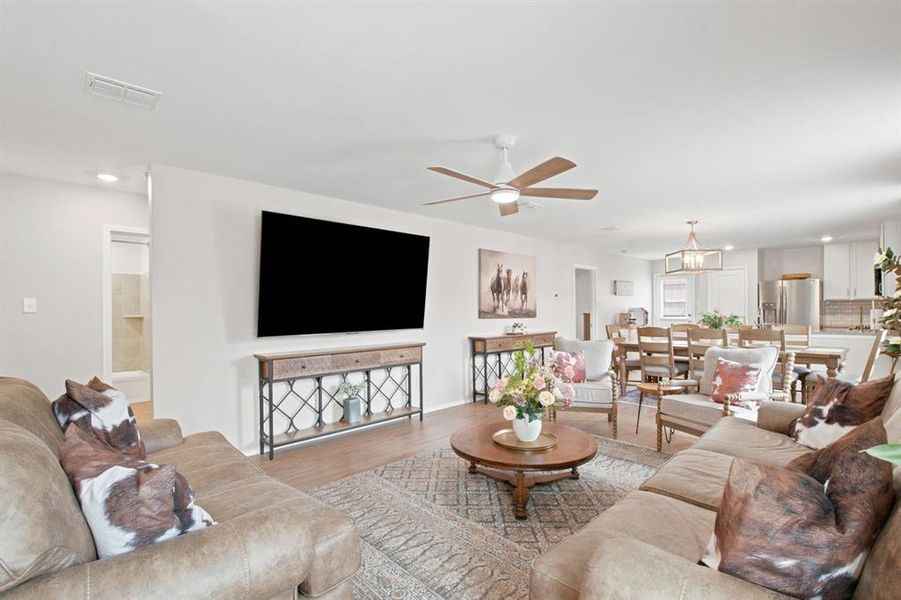 Large open living area open to dining and kitchen space of 1028 Naranjos Dr, Haslet TX in Rancho Canyon