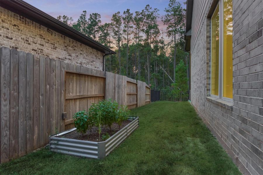 Exterior details and patio area of a home in Woodforest 50′, Montgomery (Image 24).