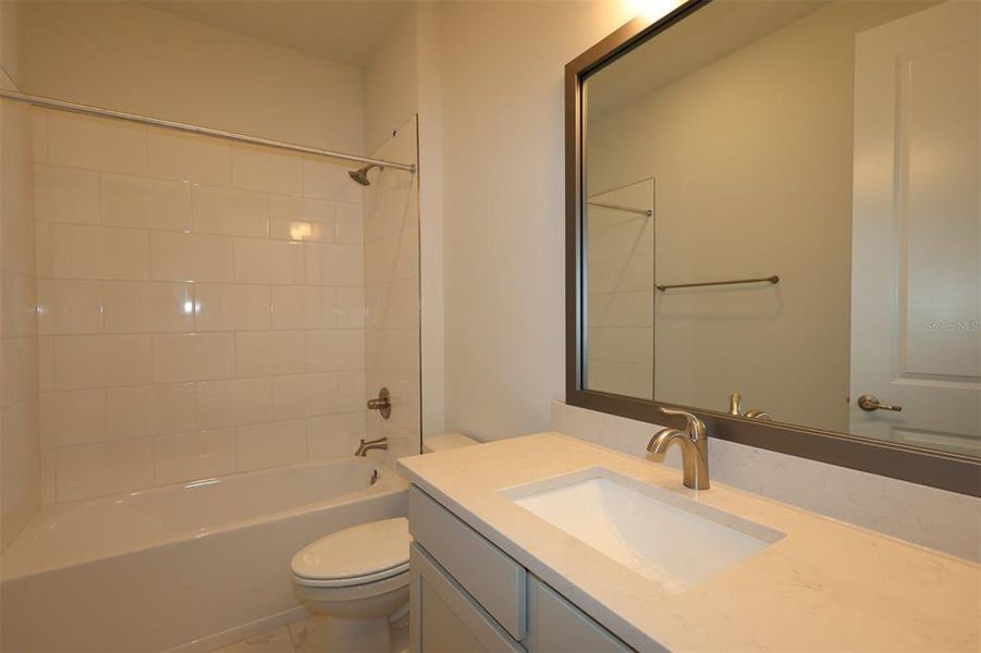 Furnished interior view inside a new home in The Peninsula at Rhodine Lake, Riverview (Image 16).