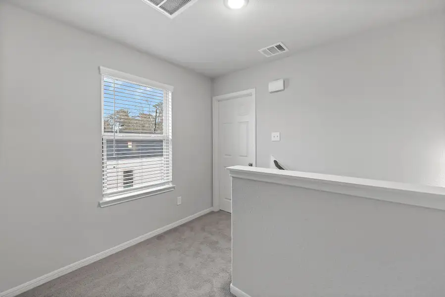 Representative unfurnished interior of a home built from the Floor Plan 1597 by Colina Homes in Rollingbrook Estates, Baytown (Image 28).