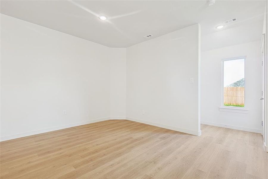 Empty room featuring light wood-type flooring