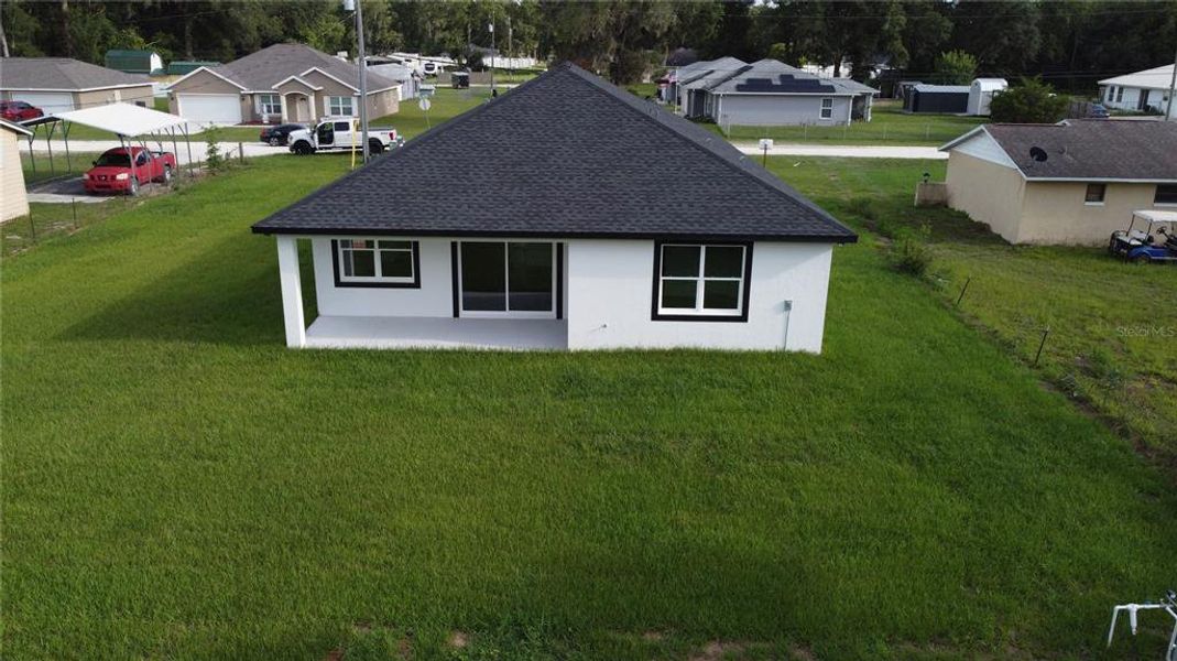 Exterior details and patio area of a home in , Summerfield (Image 29).