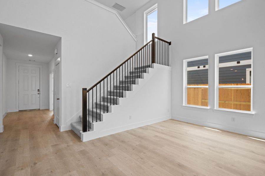 Bathed in natural light from large windows, the dining area invites you to gather around a stylish table, perfect for everything from casual breakfasts to festive dinner parties.