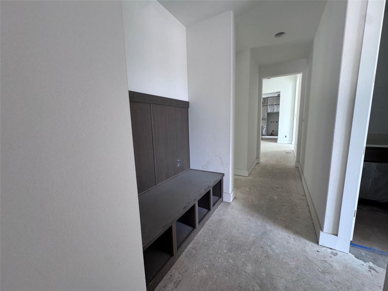 A clever built-in bench and cubby system provides storage in this functional mud room. A clever built-in bench and cubby system provides storage in this functional mud room.