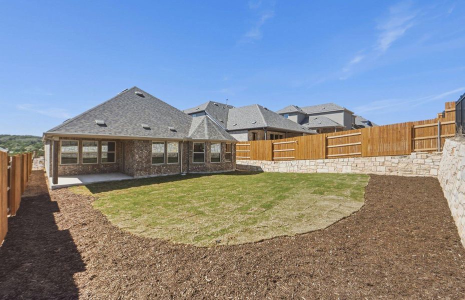 Exterior details and patio area of a home in West Cypress Hills, Spicewood (Image 20).