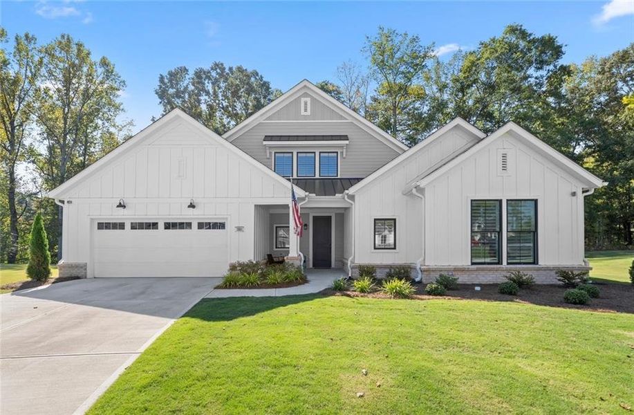 Front exterior of a new home in The Courtyards by The Manor, Alpharetta, GA, highlighting curb appeal (Image 26). Front exterior of a new home in The Courtyards by The Manor, Alpharetta, GA, highlighting curb appeal (Image 26).