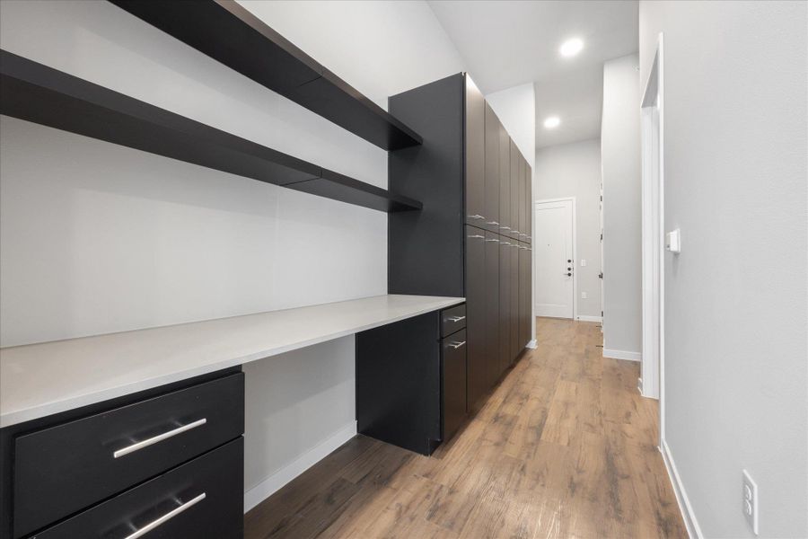 Functional built-in desk and storage cabinetry offers a versatile workspace. Functional built-in desk and storage cabinetry offers a versatile workspace.