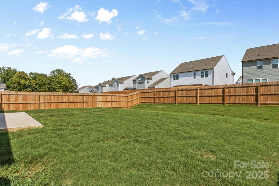 Front exterior of a new home in , Troutman, NC, highlighting curb appeal (Image 24).