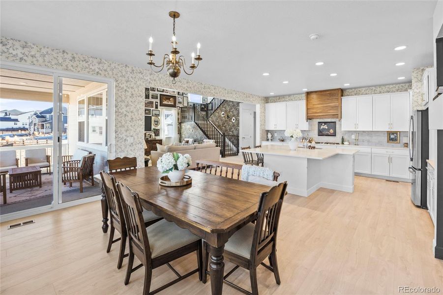 Dining area into kitchen and covered patio