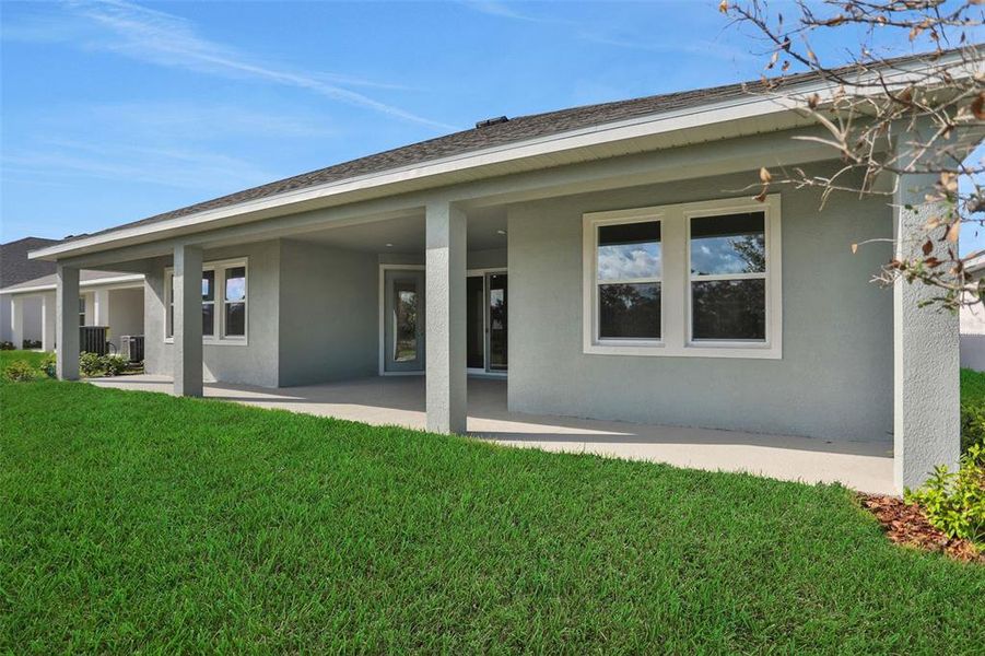 Exterior details and patio area of a home in Seaire, Parrish (Image 3).